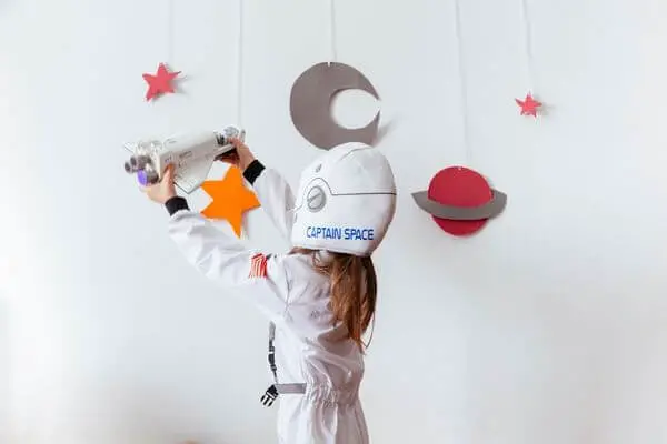 child pretending to be an astronaut