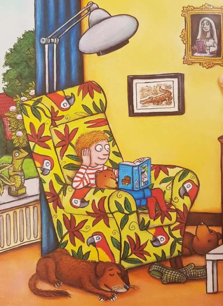 Charlie Cook reading his favourite book on his cozy chair